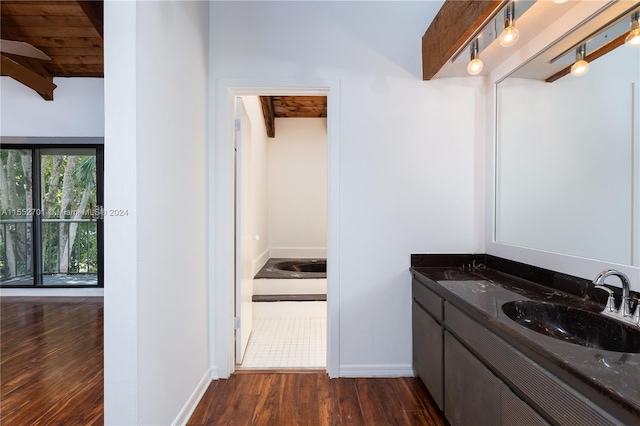 bathroom featuring lofted ceiling with beams, vanity, hardwood / wood-style flooring, and wood ceiling