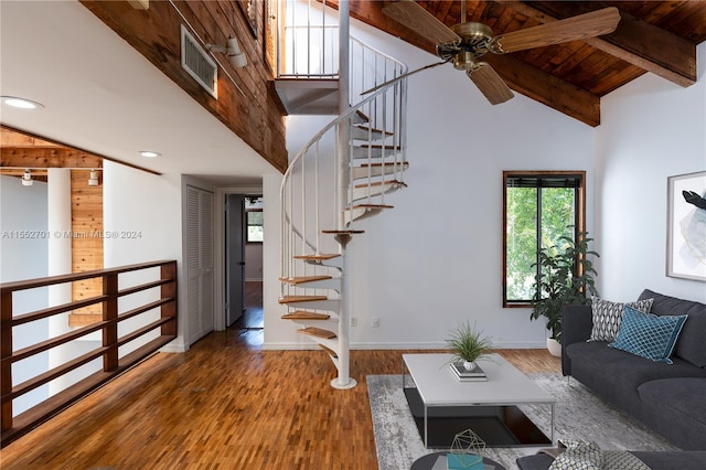 unfurnished living room with high vaulted ceiling, dark wood-type flooring, beam ceiling, and wooden ceiling