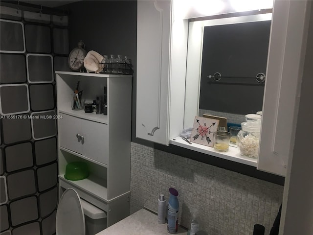 bathroom with tasteful backsplash