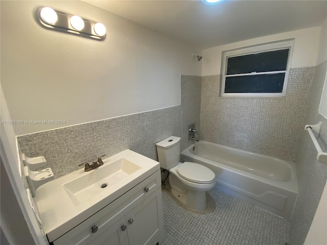 full bathroom with  shower combination, toilet, tile flooring, and vanity