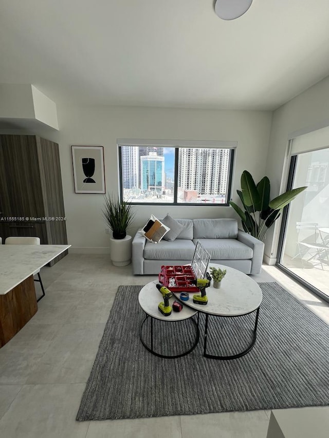 living room featuring light tile floors