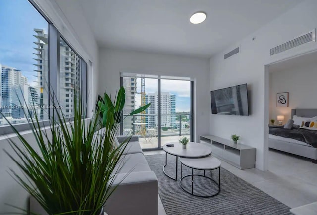 living room featuring light tile floors