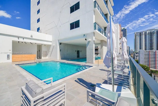 view of pool featuring a patio area