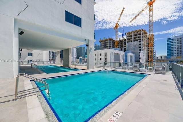 view of pool featuring a patio area