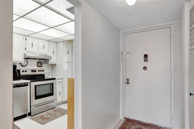 kitchen with white cabinetry, electric stove, a textured ceiling, and stainless steel dishwasher