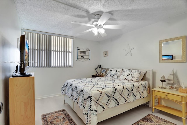 bedroom featuring a textured ceiling, carpet flooring, and ceiling fan