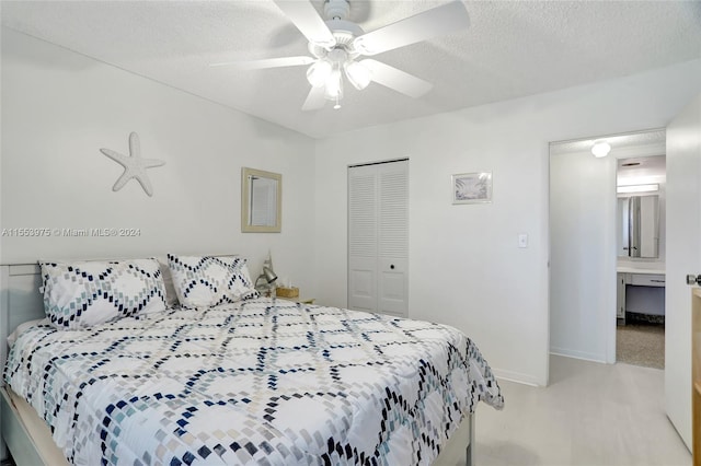 bedroom featuring a closet, ceiling fan, carpet floors, and a textured ceiling