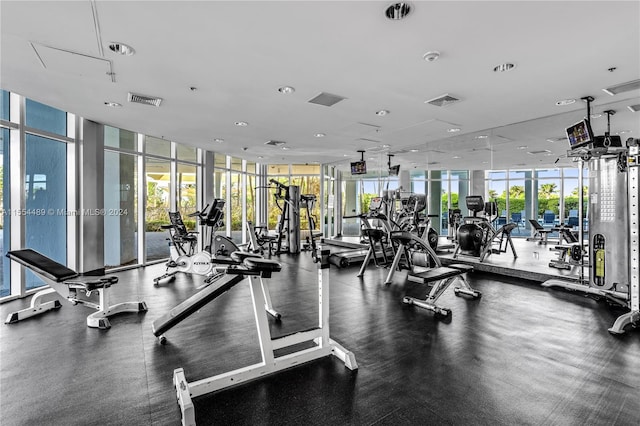 exercise room with floor to ceiling windows