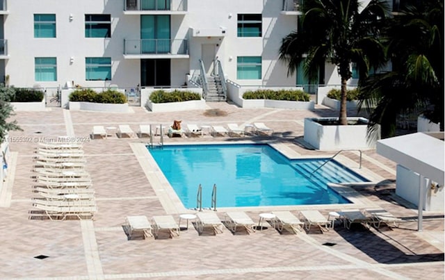 view of pool featuring a patio area