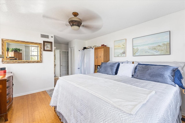 bedroom featuring ceiling fan and light hardwood / wood-style flooring