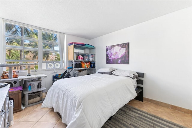 bedroom with light tile floors