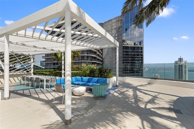 view of patio featuring a pergola, a water view, and an outdoor hangout area