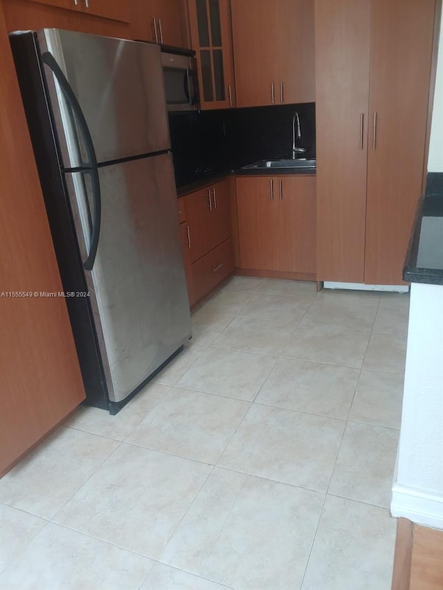 kitchen with light tile floors and appliances with stainless steel finishes