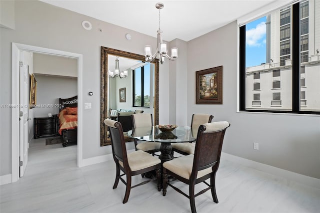 dining room with plenty of natural light and an inviting chandelier