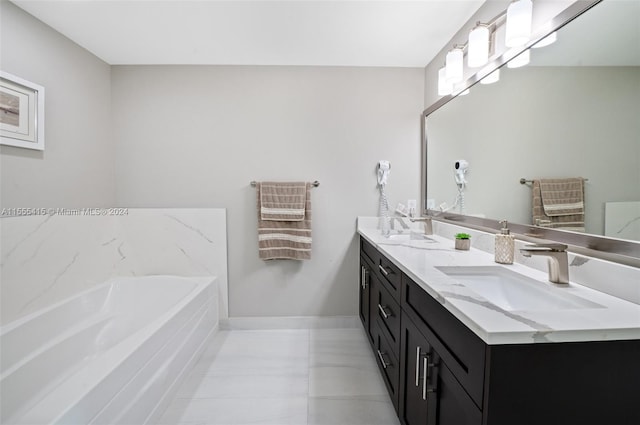 bathroom with double sink, oversized vanity, tile flooring, and a bathtub