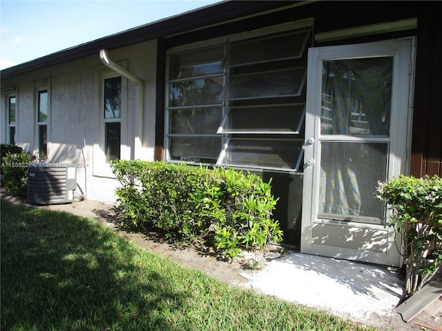 view of side of home with cooling unit