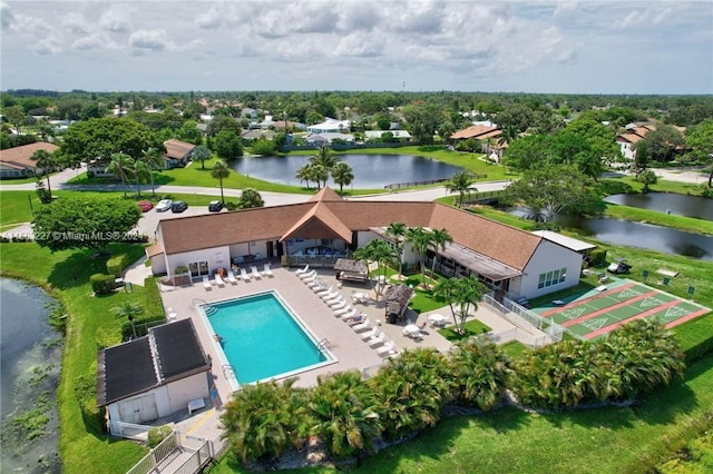 birds eye view of property with a water view