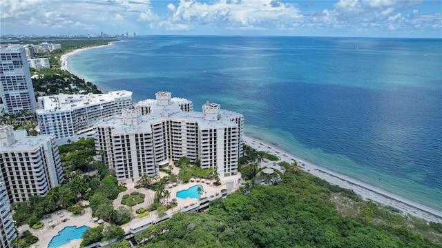 drone / aerial view featuring a view of the beach and a water view