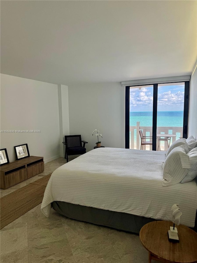 bedroom featuring a water view