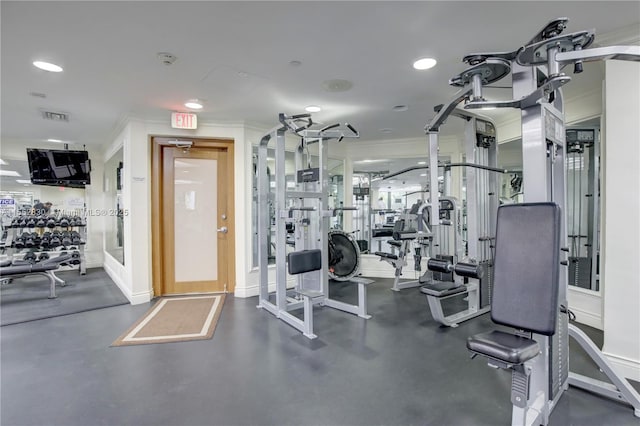 workout area with crown molding