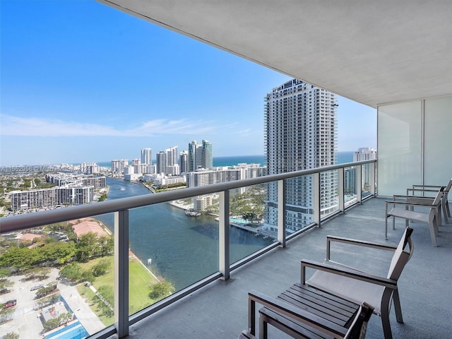 balcony featuring a water view