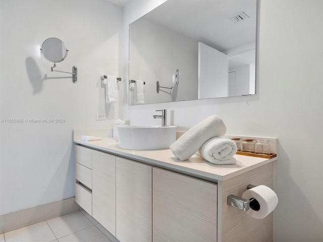 bathroom with vanity and tile flooring