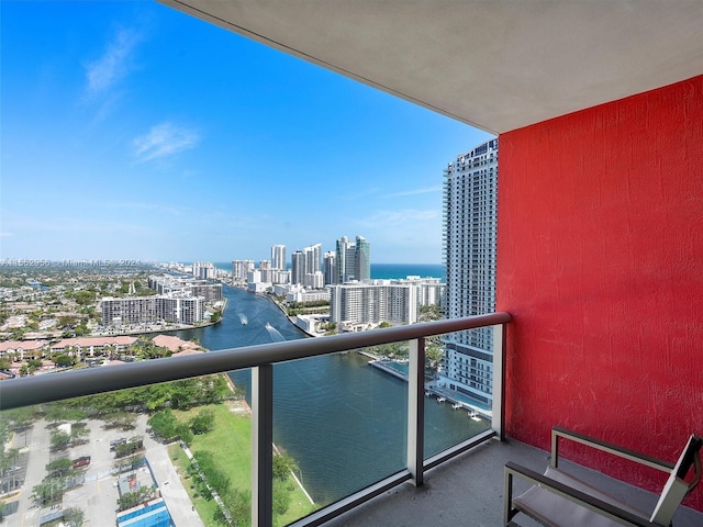 balcony featuring a water view