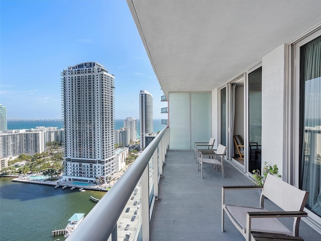 balcony featuring a water view