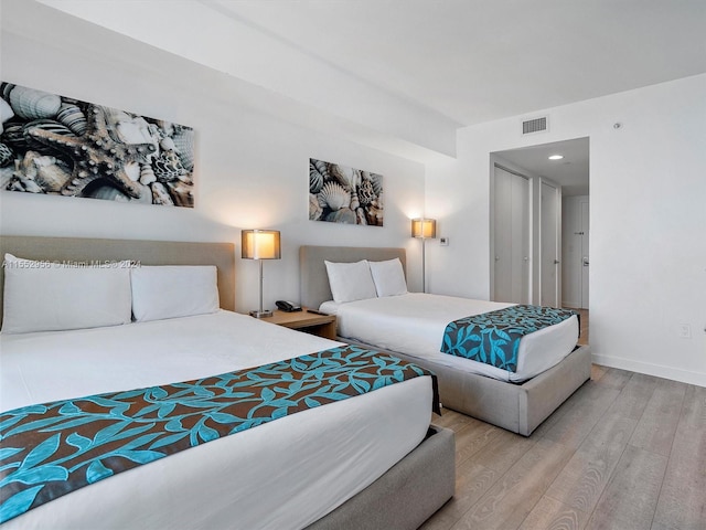 bedroom featuring light wood-type flooring