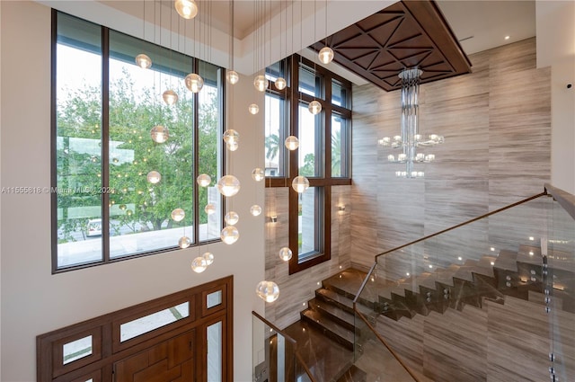 entrance foyer with an inviting chandelier and a wealth of natural light