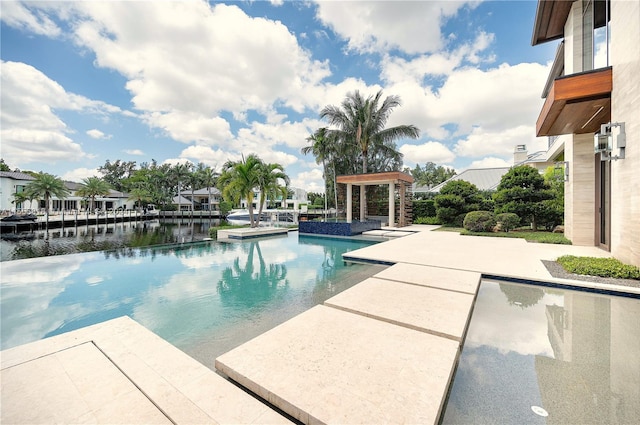 view of pool with a patio area and a boat dock