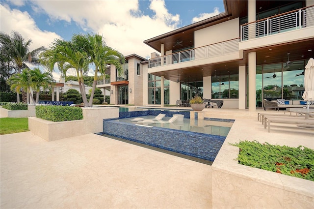 view of swimming pool featuring a patio area, a hot tub, and ceiling fan