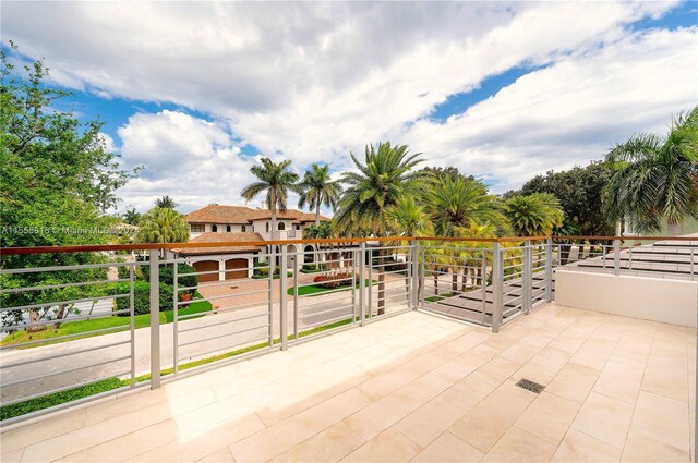 view of patio featuring a balcony