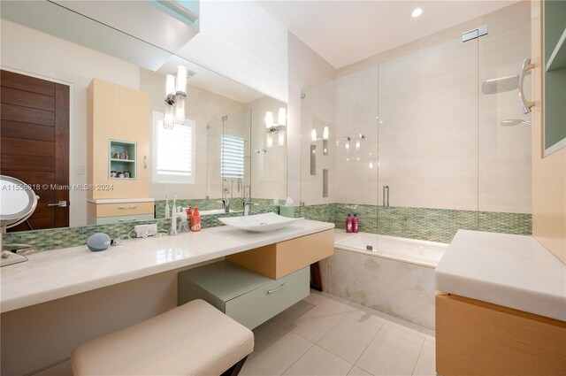 bathroom with shower with separate bathtub, tile patterned floors, and vanity