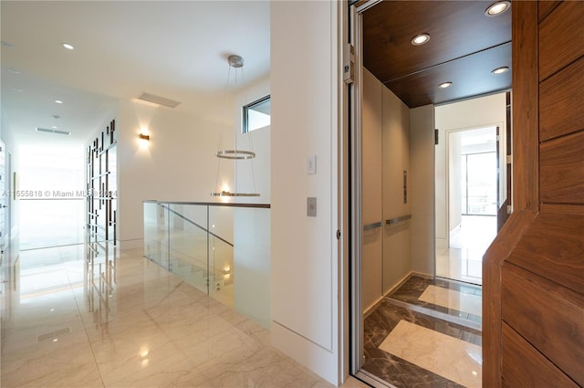 corridor with tile patterned floors