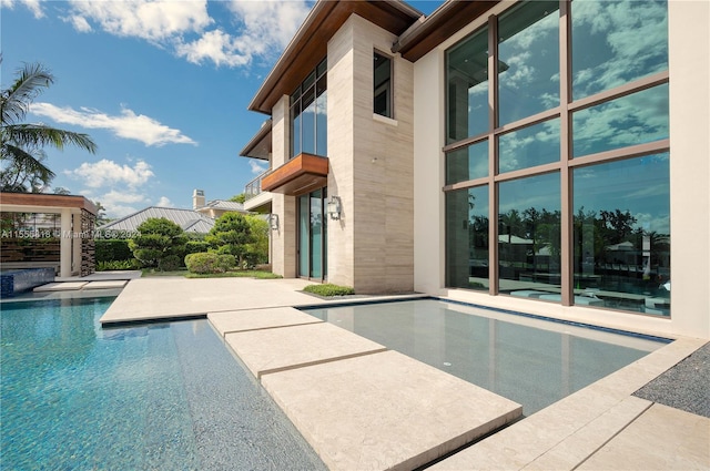 view of swimming pool with a patio