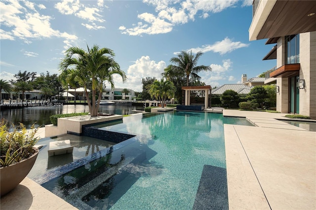 view of swimming pool featuring a water view