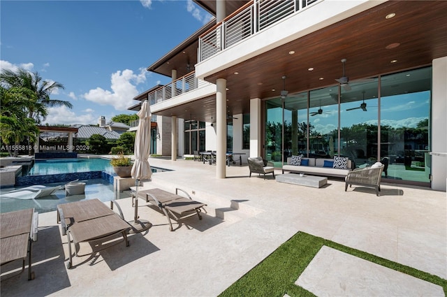 exterior space featuring ceiling fan, outdoor lounge area, a pergola, and a balcony