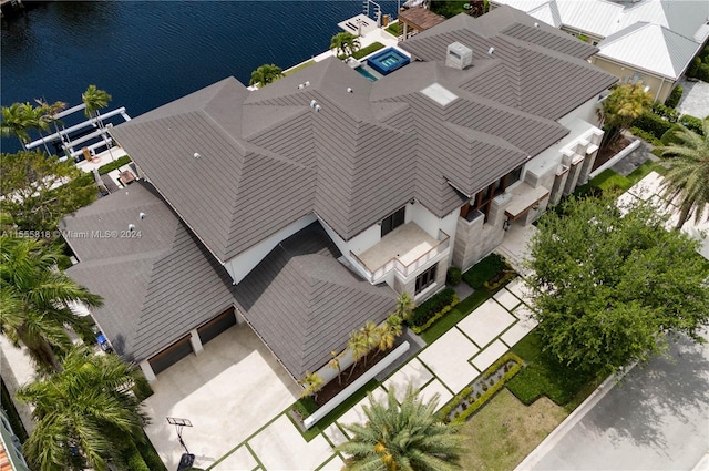 birds eye view of property with a water view