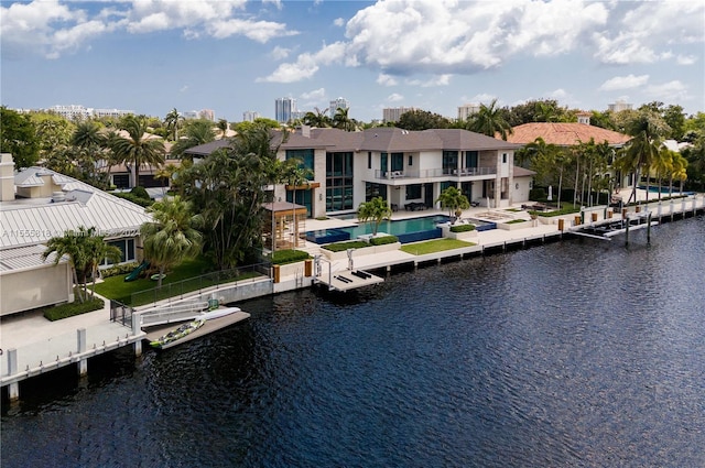 exterior space featuring a balcony, a water view, and a patio area