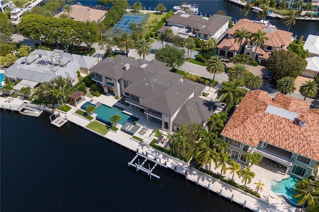 birds eye view of property with a water view