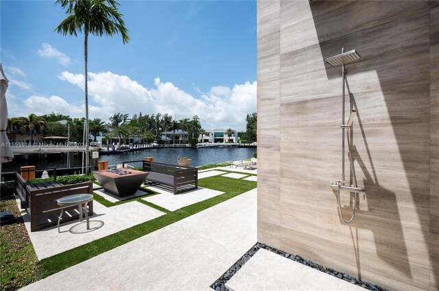 view of patio featuring an outdoor living space and a water view