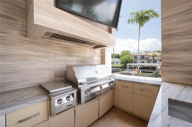 view of patio / terrace featuring area for grilling and a balcony