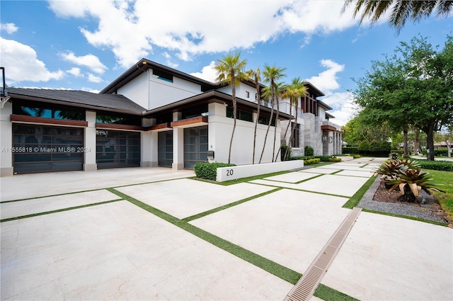 back of house featuring a garage