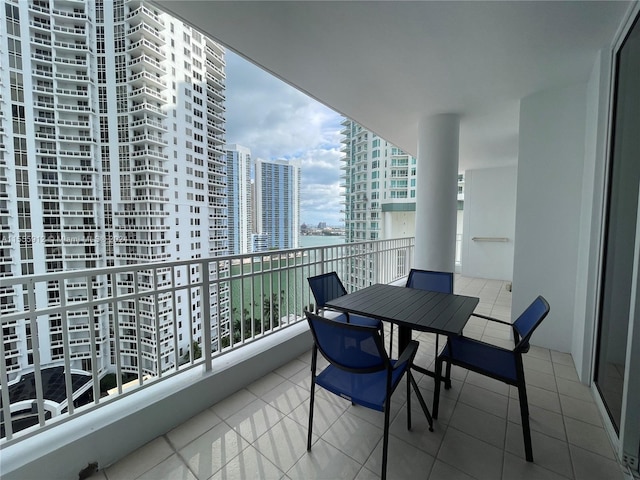 801 Brickell Key Blvd Unit 1610, Miami, FL 33131 - balcony featuring a view of city, outdoor dining area, and a water view