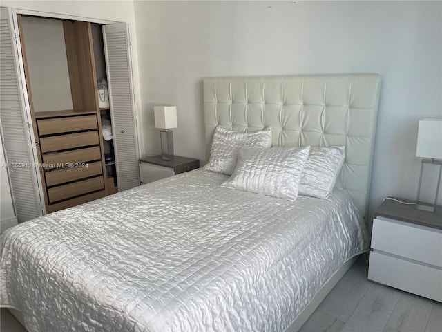 801 Brickell Key Blvd Unit 1610, Miami, FL 33131 - bedroom with wood finished floors and a closet
