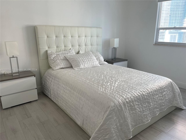 801 Brickell Key Blvd Unit 1610, Miami, FL 33131 - bedroom with wood finished floors