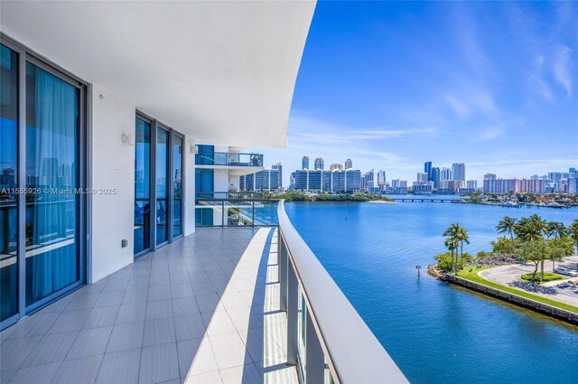 balcony featuring a water view