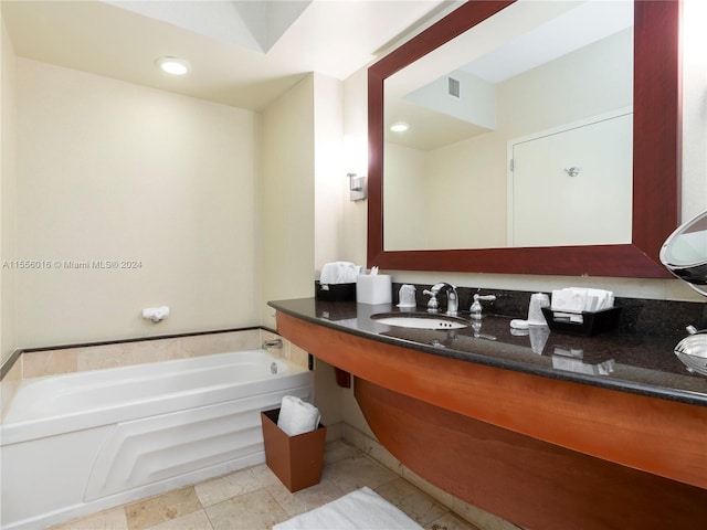 bathroom with a bathing tub and vanity