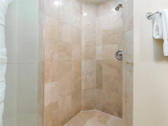 bathroom with tiled shower